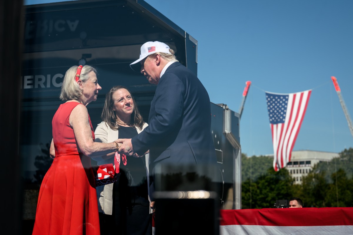 President Donald Trump speaks at a podium during a White House event.