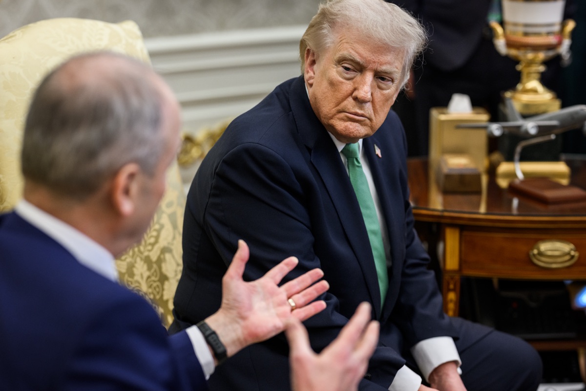 Donald Trump listens to a foreign leader during a bilateral meeting in the Oval Office.